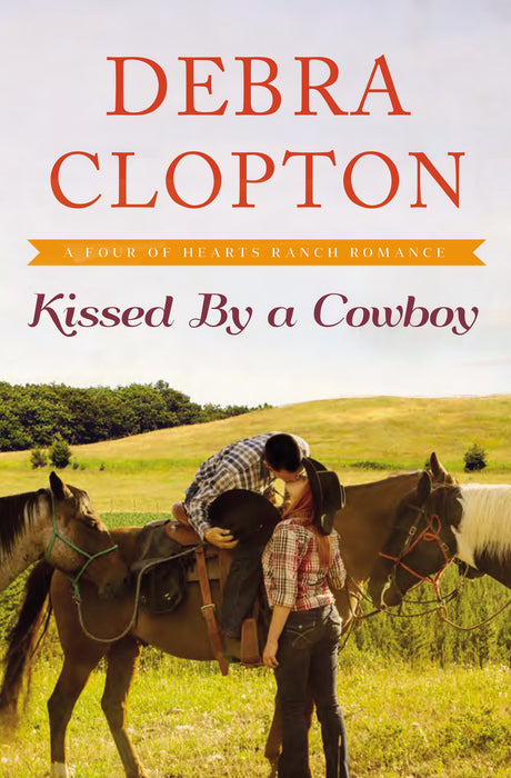 Kissed By A Cowboy (Four Of Hearts Ranch Romance)